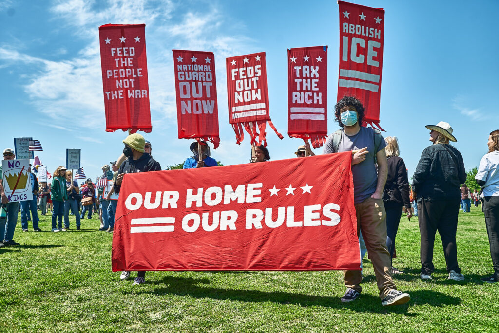 A group of Free DC protestors carrying signs