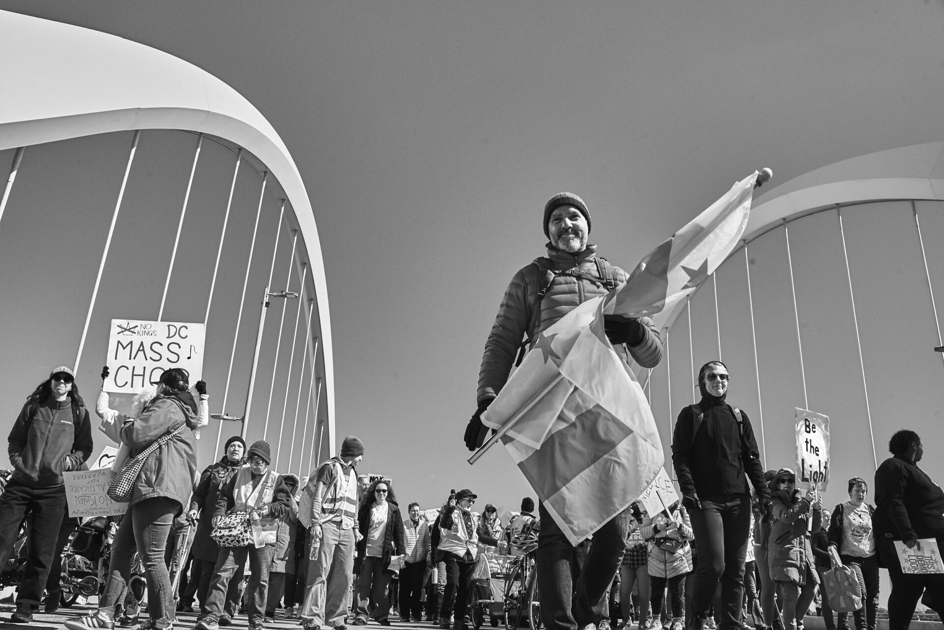 Protestors cross the Frederick Douglass Bridge in Washington, DC
