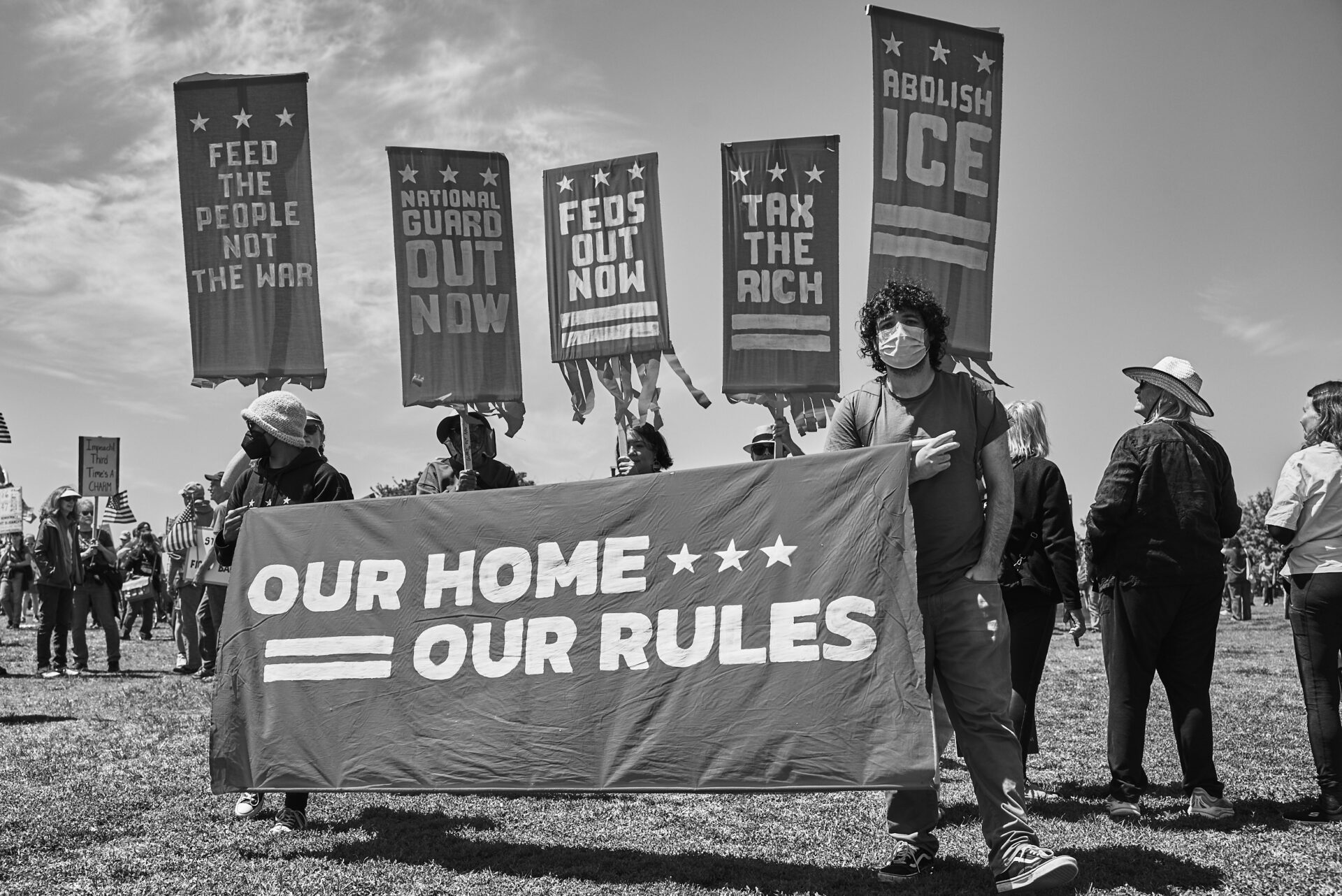 Free DC protestors carrying banners and signs